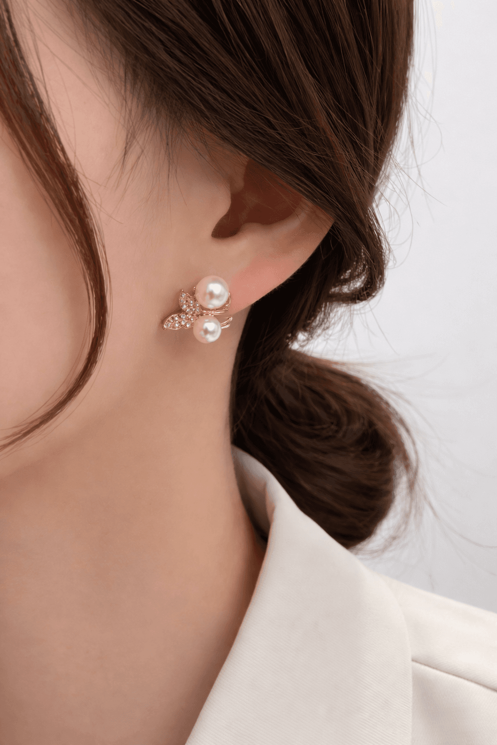 Gold Toned pearl and crystal stud earrings