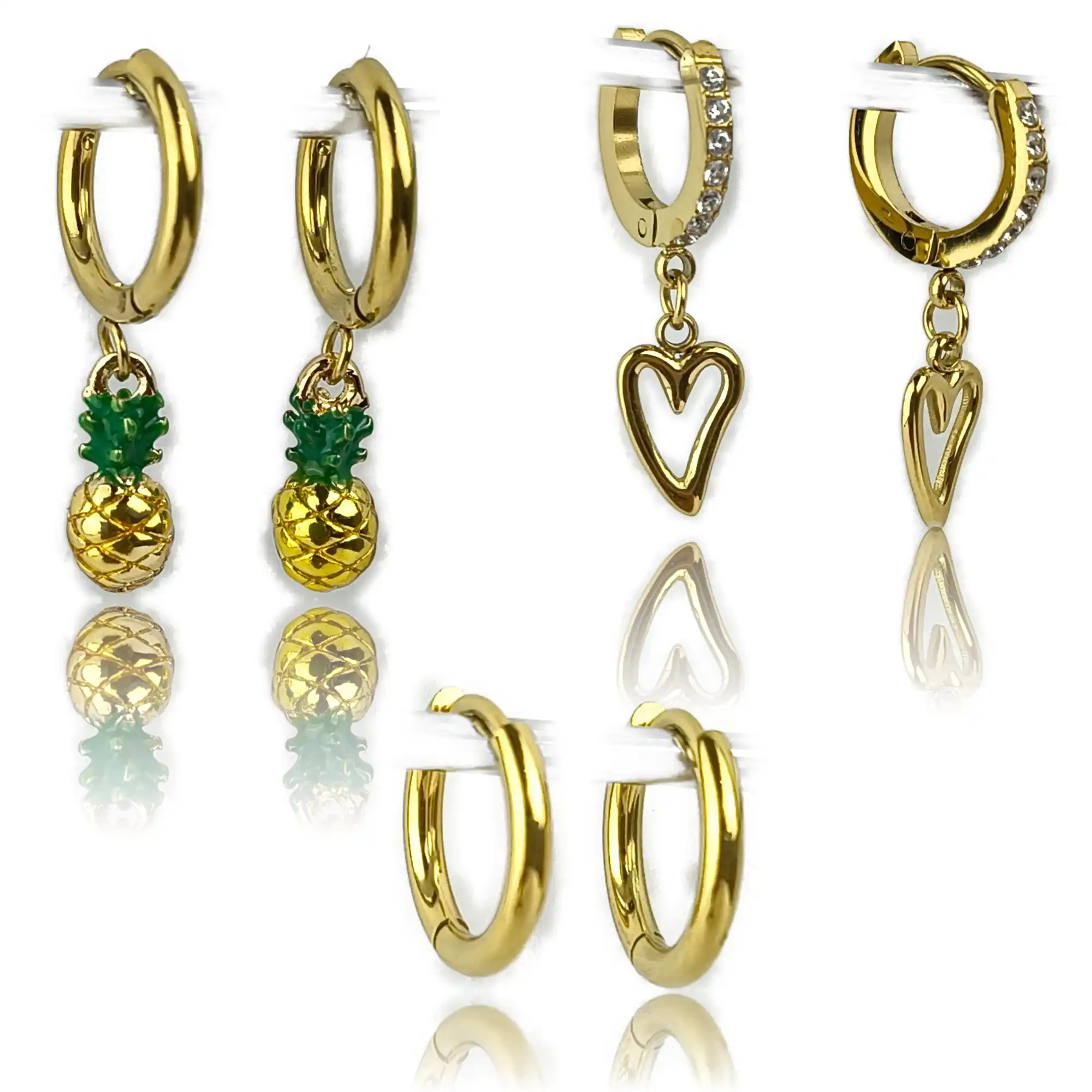 Four pairs of gold-plated huggie hoop earrings: two with green-leafed pineapple charms, one with a cubic zirconia hoop and open heart charm, and one plain polished hoop pair, displayed on a white background with reflections.
